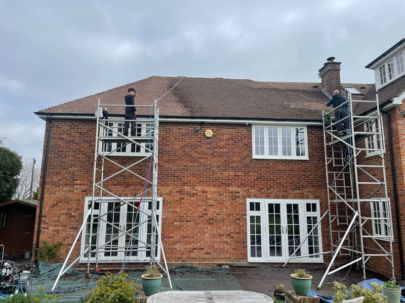 Roof cleaning carried out safely from scaffold towers by The Roof Moss Cleaners in Aylesbury